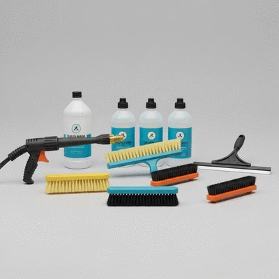 Roof cleaning tools and equipment laid out on a clean, light background